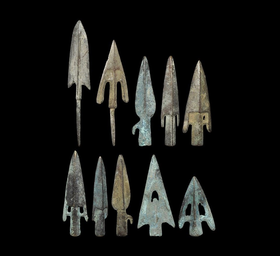 Greek and Near Eastern Style Arrowhead Collection: A mixed group of undated archaistic cast bronze arrowheads comprising: two barbed and tange3d; six barbed and socketted; two leaf-shaped, socketted with lateral spur. 248 grams total, 49-100mm (2 - 4"
