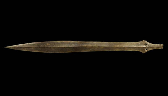 Bronze Age 'Ballintober' Type Sword: 1200-1000 BC. A long, leaf-shaped blade with midrib, flared lozengiform shoulders and notched hilt; two large rivet holes between the shoulders. 446 grams, 55.5cm (22"). Ex Sir Richard Ground (1949-20