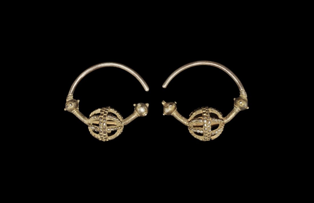 Byzantine Silver-Gilt Temple-Ring Pair: 11th-12th century AD. A matched pair of ornaments, each formed as a round-section bar with two solid bulbs, another in openwork and wound wire panels; the solid bulbs with knop detailing, the openwork