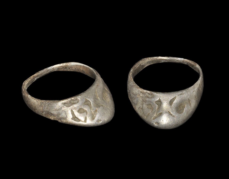 Medieval Silver Child's Archer's Ring: 13th-15th century AD. A flat-section hoop with triangular flange extension, incised scrolled patterns. 2.9 grams, 26mm overall, 18.08mm internal diameter (approximate size British P, USA 7 3/4, Europe