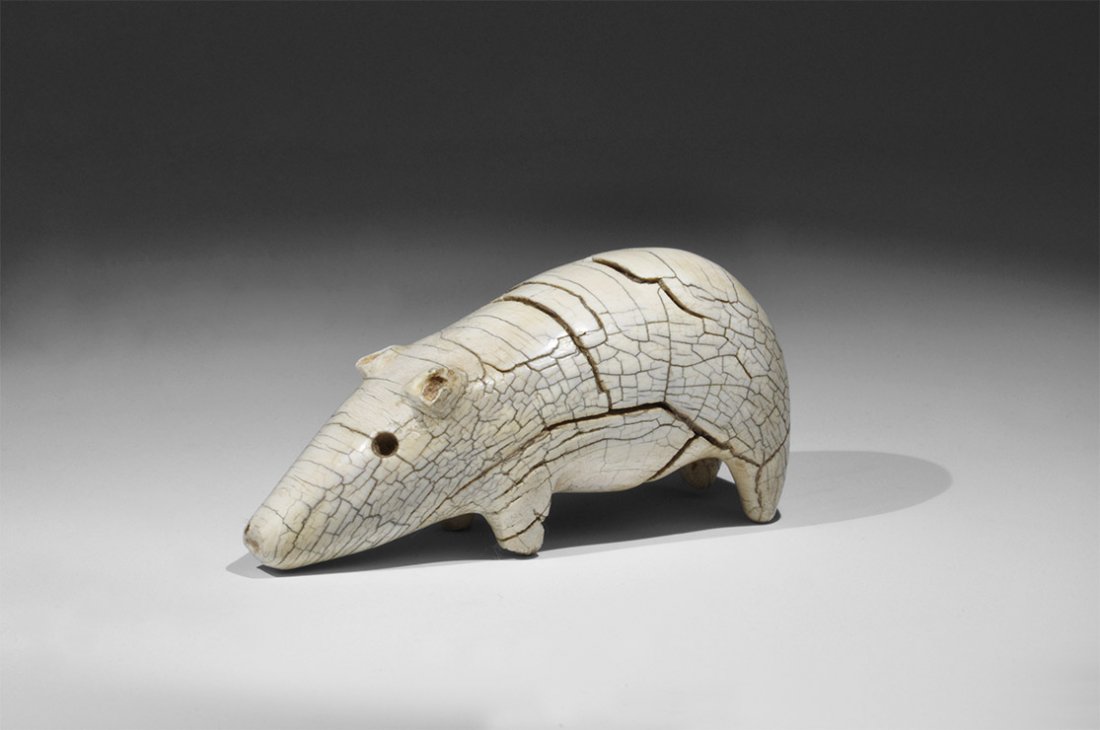 North American Inuit Ivory Bear Totem Figurine: 1720-1825 AD. A substantial carving of a bear with circular holes for eyes, D-shaped ears. 12 grams, 88mm (3 1/2"). Property of a London gentleman; acquired before 1980. With a QED laboratory certific