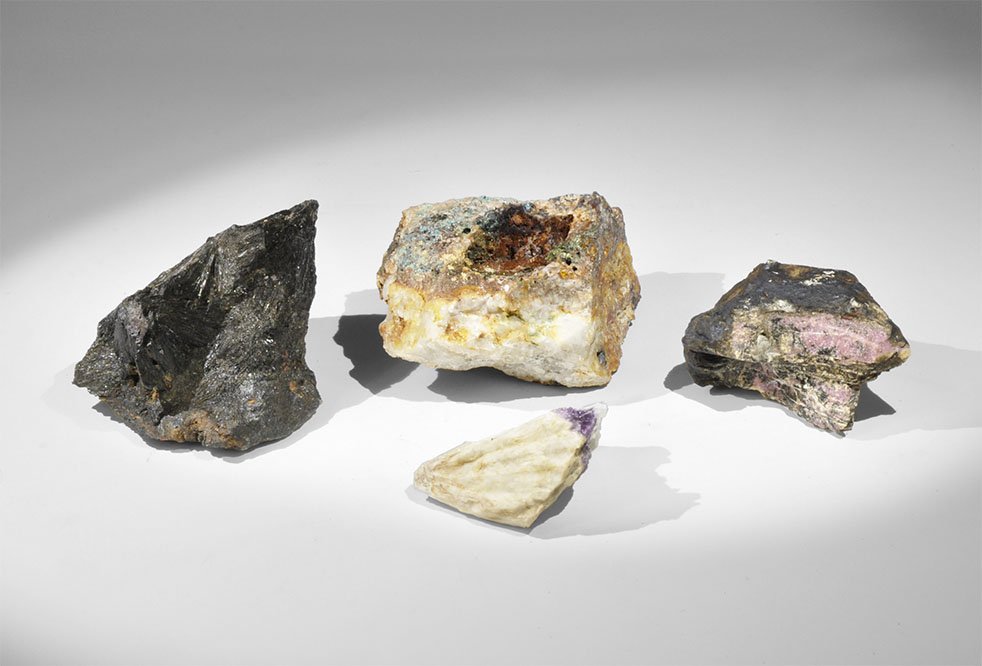 Geological Cornwall Rhodonite, Tourmaline, Siderite and: A mixed group of mineral specimens comprising: rhodonite, tourmaline, siderite and amethyst. 971 grams total, 46 - 98mm (1 3/4 - 4"). Ex Bernard C. Pickard collection, Hampshire, UK. [4, No Reserve]