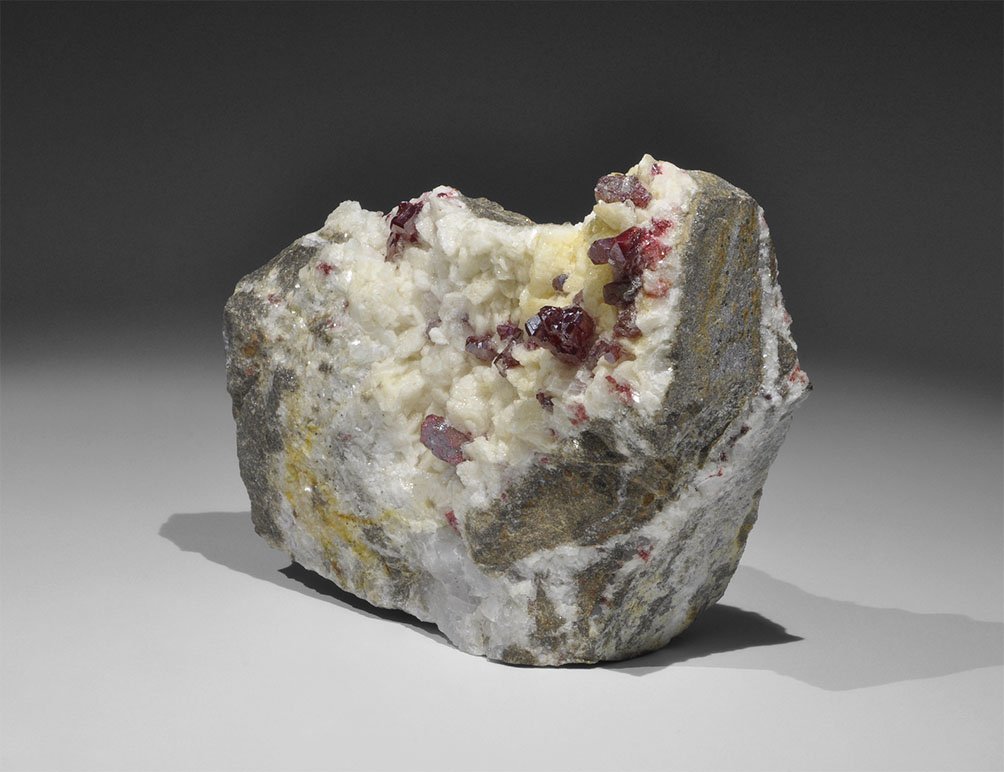 Geological Cinnabar on Dolomite Mineral Specimen: Fine and unusually large crystals of cinnabar (mercury sulphide) rest on crystalline dolomite, from Tong Ren Mine, Gui Zhou Province, China; in old white card tray. 317 grams, 11cm (4 1/4"). From a hi