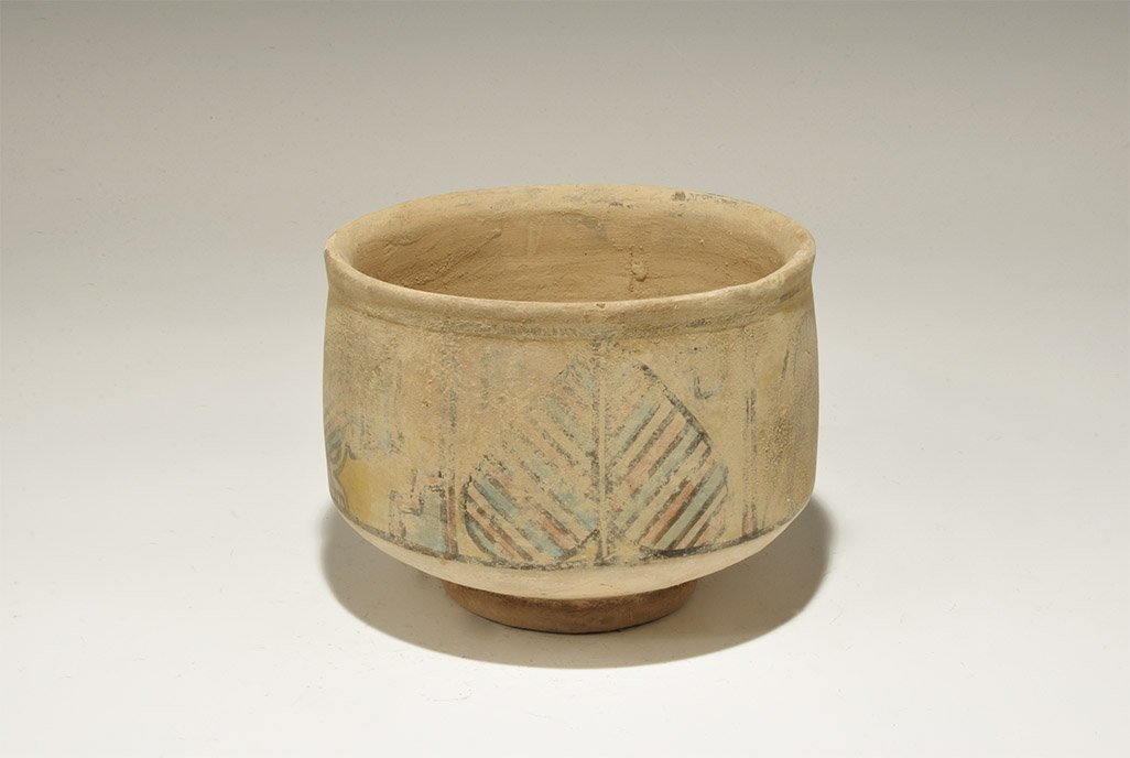Indus Valley Mehrgarh Polychrome Ceramic Cup with Lion: 3300-1700 BC. A footed bowl with everted rim, polychrome frieze with lion, ox, peepal leaf and geometric panel. 730 grams, 14cm (5 1/2"). Private collection, Cambridgeshire, UK; acquired prior to 2000