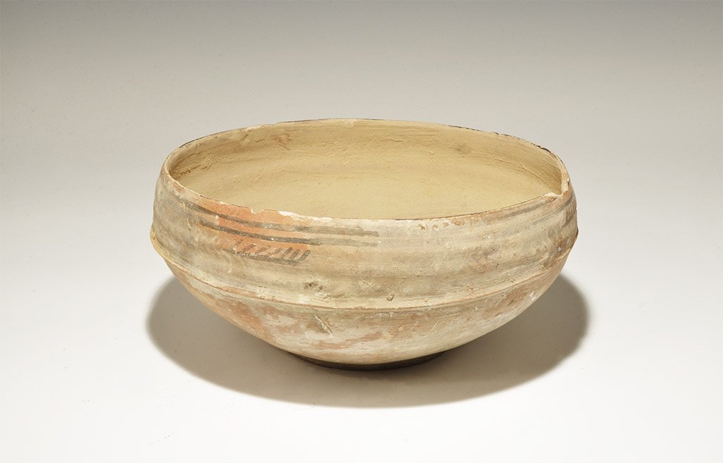 Indus Valley Mehrgarh Large Bichrome Ceramic Bowl with: 3300-1700 BC. A broad terracotta bowl of keeled profile with painted band of fronds to the shoulder. 900 grams, 23.5cm (9 1/4"). Private collection, Cambridgeshire, UK; acquired prior to 2000. Cf. Sat