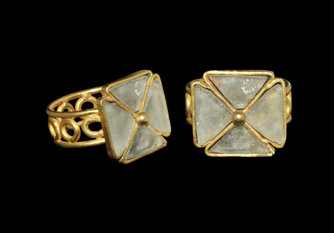 Vintage Gold Ring with Glass Cross Inserts: An undated archaistic Byzantine style ring with hoop formed as two parallel rods with annulets between; the bezel a rectangular cell with four sub-triangular glass inserts, central granule. 9.74 grams