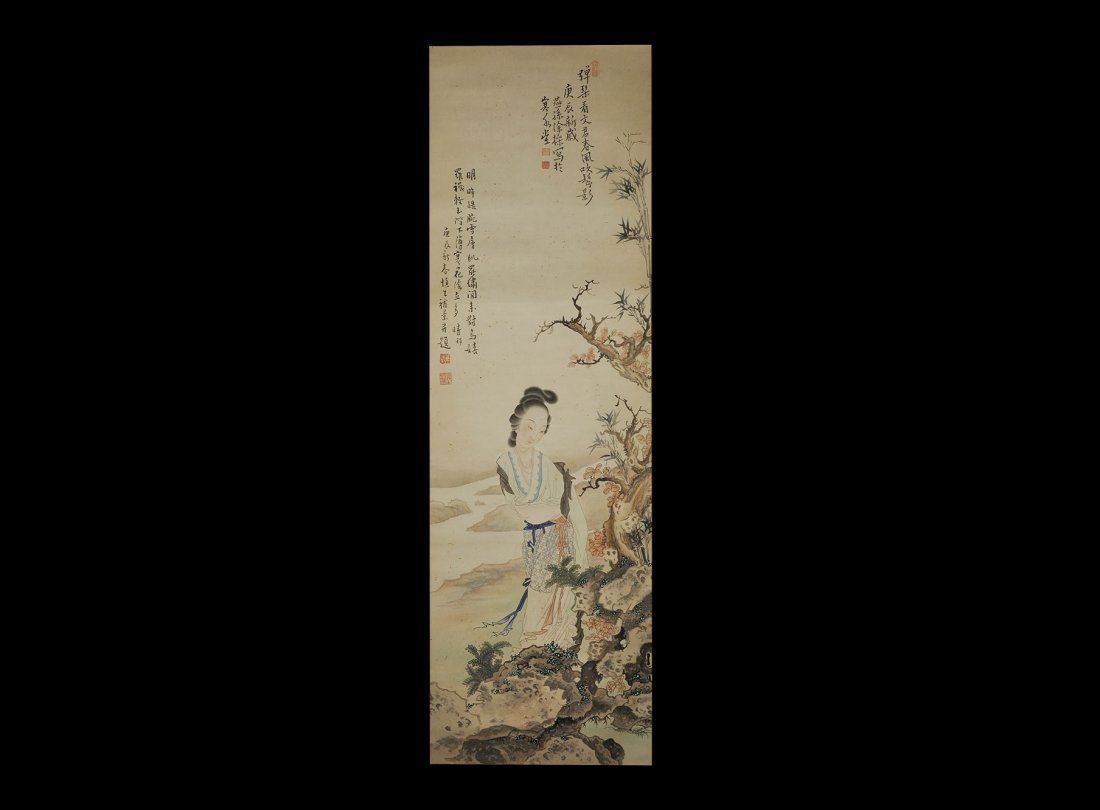 Chinese Xu Cao Scroll Painting with Figure: 20th century AD. A rectangular paper panel on a fabric backing with wooden roller; robed girl on a riverside path with tree in blossom; block of three columns of calligraphic text and two red chop sea