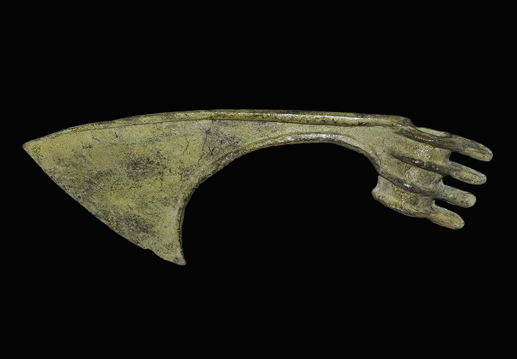 Luristan Style Comb-Backed Axehead: 20th century AD. A short bronze tubular socket with four moulded ribs projecting to the rear to form spikes; thin blade with reinforced edges, swept profile. 405 grams, 24cm (9 1/2"). UK art market, a
