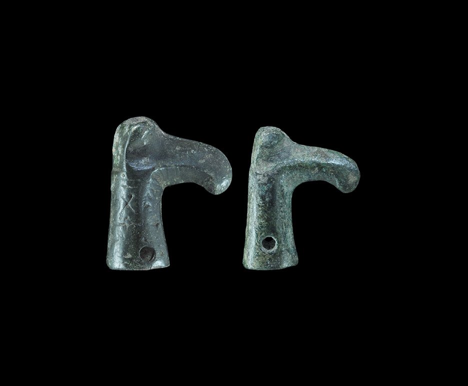 Baltic Viking Bronze Raven Head Staff Terminal: 12th-13th century AD. A group of two staff terminals, each a slightly tapered tubular socket with opposed piercings, finial in the form of a bird's head with hooked beak. Cf. Griciuviene, E. Žiemgali