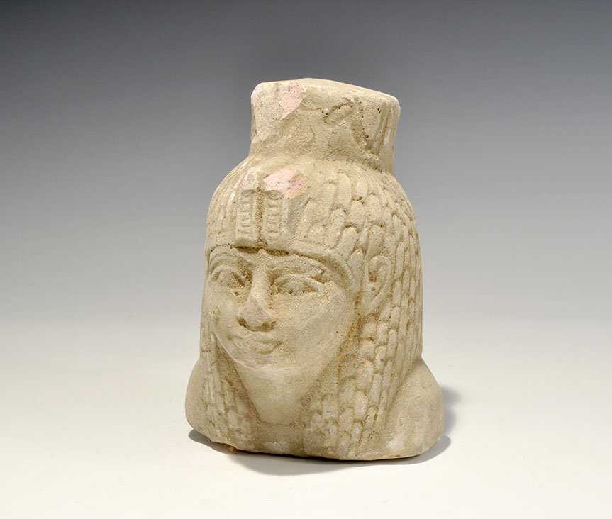 Egyptian Style Stone Head: 20th century AD. A carved travertine female head with feathered headdress. 1.8 kg, 17.5cm (7"). Acquired on the London art market before 1995. [No Reserve]