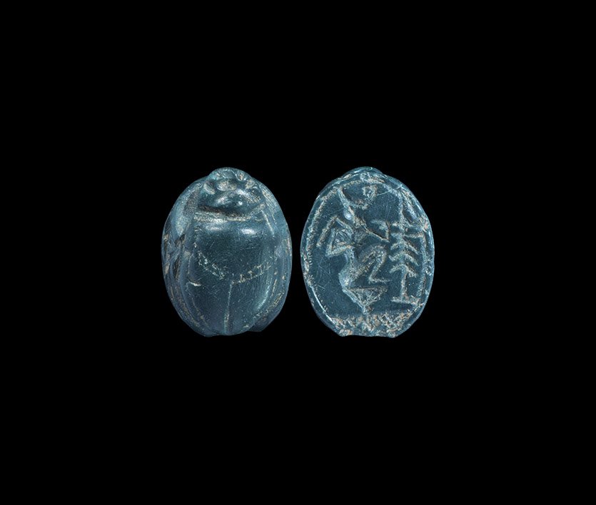 Phoenician Green Jasper Scarab with Horus: 6th-4th century BC. A green jasper scarab, the underside with intaglio design of Horus on a lotus with incense burner before. 1.53 grams, 15mm (1/2"). Private collection, London, UK; acquired Bonhams,