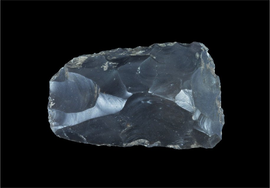 Stone Age Knapped Handaxe: Palaeolithic, 400000-300000 BP. A finely-knapped flint handaxe with rounded butt and slightly eccentric cutting edge. 238 grams, 10cm (4"). From an old Munich collection; acquired on the German art ma