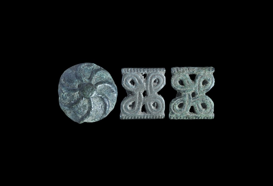 Viking Belt Slide and Mount Group: 10th-11th century AD. A mixed group of bronze Scandinavian type fittings (also widespread in the historical Rus region), comprising: two slides, each with openwork looped cross motif within notched bo