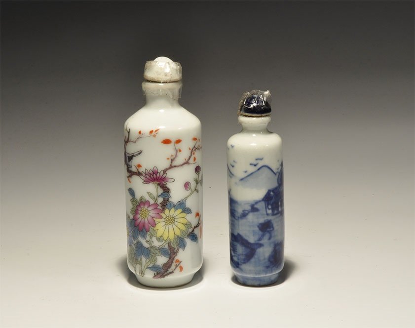 Chinese Style Perfume Bottle Group: 20th century AD. A pair of white-glazed ceramic bottles, one with blue landscape, one with polychrome flowers. 79 grams, 68-82mm (2 1/2 - 3 1/4"). Acquired on the London art market before 1995.[2, No