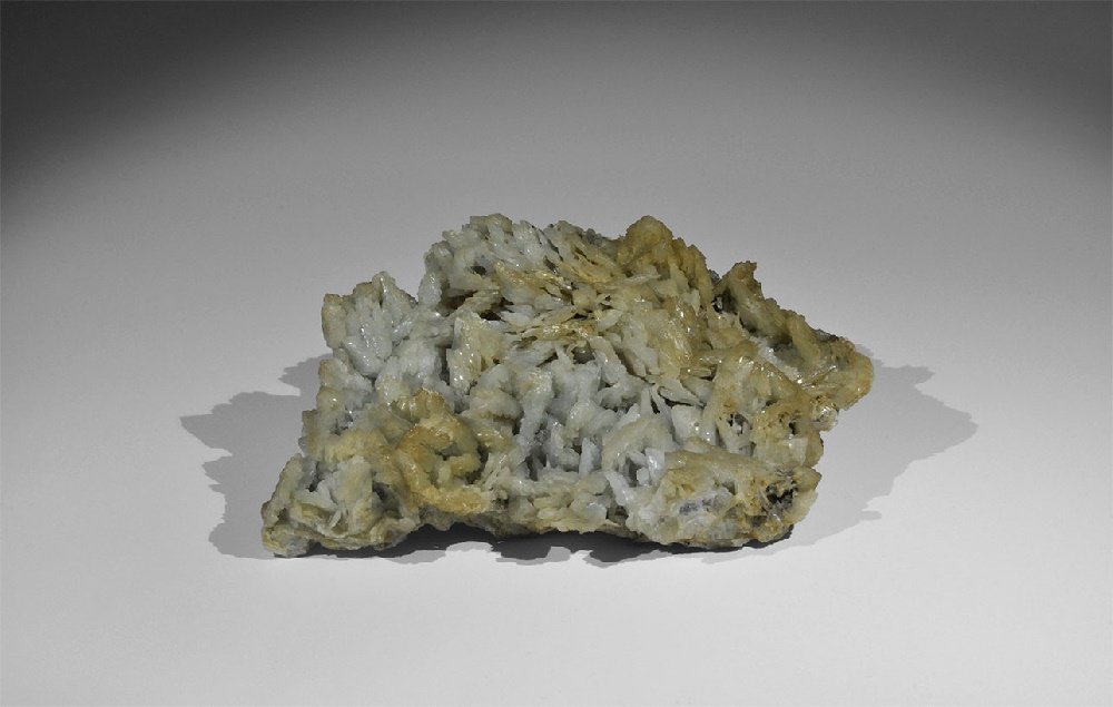 Geological Baryte Mineral Specimen: A large specimen of bladed blue-gray barite (or baryte), a barium sulphate, from the Gregory, Bottley, and Lloyd collection. 507 grams, 15cm (6"). From Baia Sprie, Romania. From a historic ‘Victoria