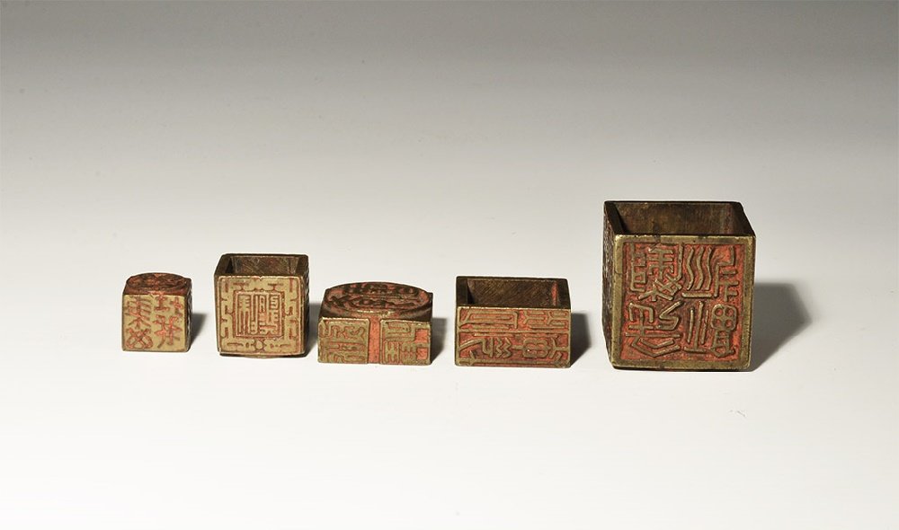 Chinese Calligraphic Twenty-Six Face Chop Seal Set: 19th century AD. A nested set of chop seals comprising: a small (15mm) cube with text and Buddhist symbols, a five-faced cube with seal to each face, a four-faced sleeve (one with two seals), a five-f