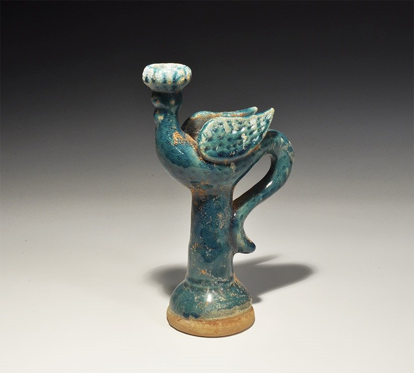 Chinese Style Glazed Ewer: An undated archaistic blue-glazed ceramic jug with flared base, tall neck, strap handle formed as a bird's tail, the body flanked by raised wings, head forming the spout. 540 grams, 21.5cm (8 1/2"). L