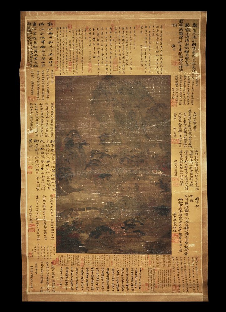 Chinese Style Scroll Picture: 20th century AD. A rectangular paper panel on a fabric backing with wooden roller; painting of a mountainous landscape with trees, surrounded by blocks of calligraphic text and chops seals. 529 grams,