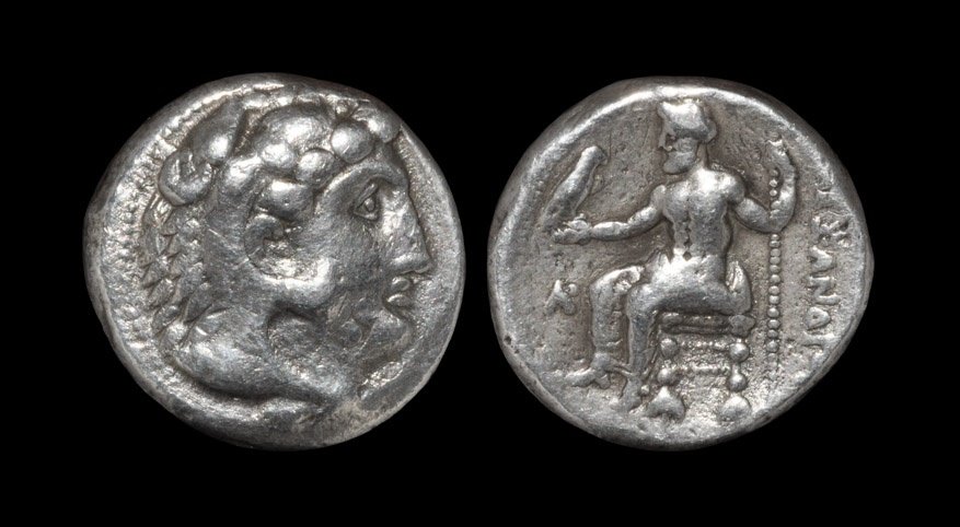 Ancient Greek Coins - Macedonia - Alexander III - Zeus: 330-320 BC. Byblos mint, lifetime issue. Obv: head of Herakles right in lionskin headdress. Rev: ALEXANDROU legend to right of Zeus seated left on backless throne, holding eagle and sceptre; AR monogr