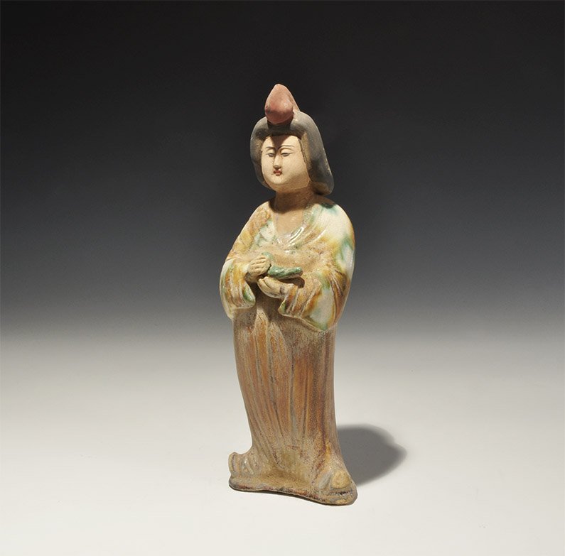 Chinese Noble Lady Figurine: . An undated archaistic part-glazed figurine of a robed lady cradling a birds; hollow to the underside. 479 grams, 25cm (9 3/4"). London private collection, acquired 1985-1995. [No Reserve]