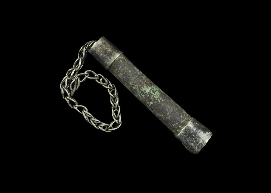 Viking Needle Case Pendant: 9th-11th century AD. A pendant comprising a tubular copper stem with silver collar to each end, internal bar and short length of silver chain attached. 10 grams, 17cm with chain (6 1/2"). From a Europ