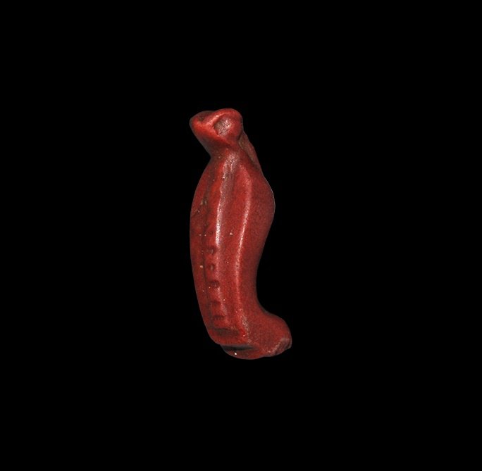 Egyptian Uraeus Amulet: New Kingdom, 1550-1070 BC. A caved jasper uraeus amulet with ribbed body. Property of a London gentleman; acquired by his father in the 1970s; thence by descent. Cf. Andrews, C. Amulets of Ancient Egy