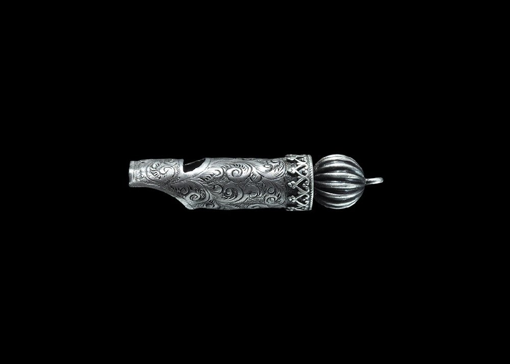 Post Medieval Hawking Whistle: 17th century AD. A delicate silver whistle with scooped mouthpiece, scrolled detail to the body, arcaded cap with 'melon' finial and loop. From an old North Country collection; formed between 1970-200