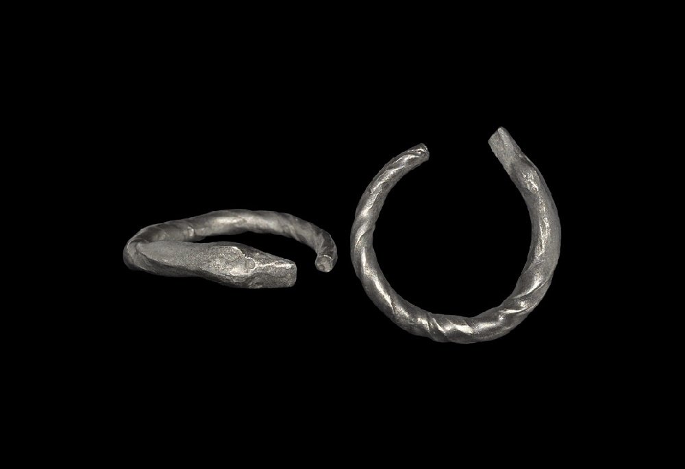 Byzantine Twisted Snake Ring: 6th-8th century AD. A round-section twisted silver penannular shank with snake-head finial. 4.0 grams, 23mm overall, 17.17mm internal diameter (approximate size British N, USA 6 3/4, Europe 13.85, Jap