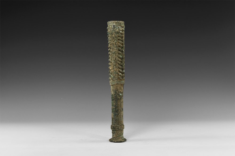 Western Asiatic Luristan Cudgel: 2nd millennium BC. A large tubular bronze cudgel with bands of raised ribs to the shaft, flared handle. 469 grams, 24cm (9 1/2") Property of a London gentleman; acquired before 1995; ex Cologne collec