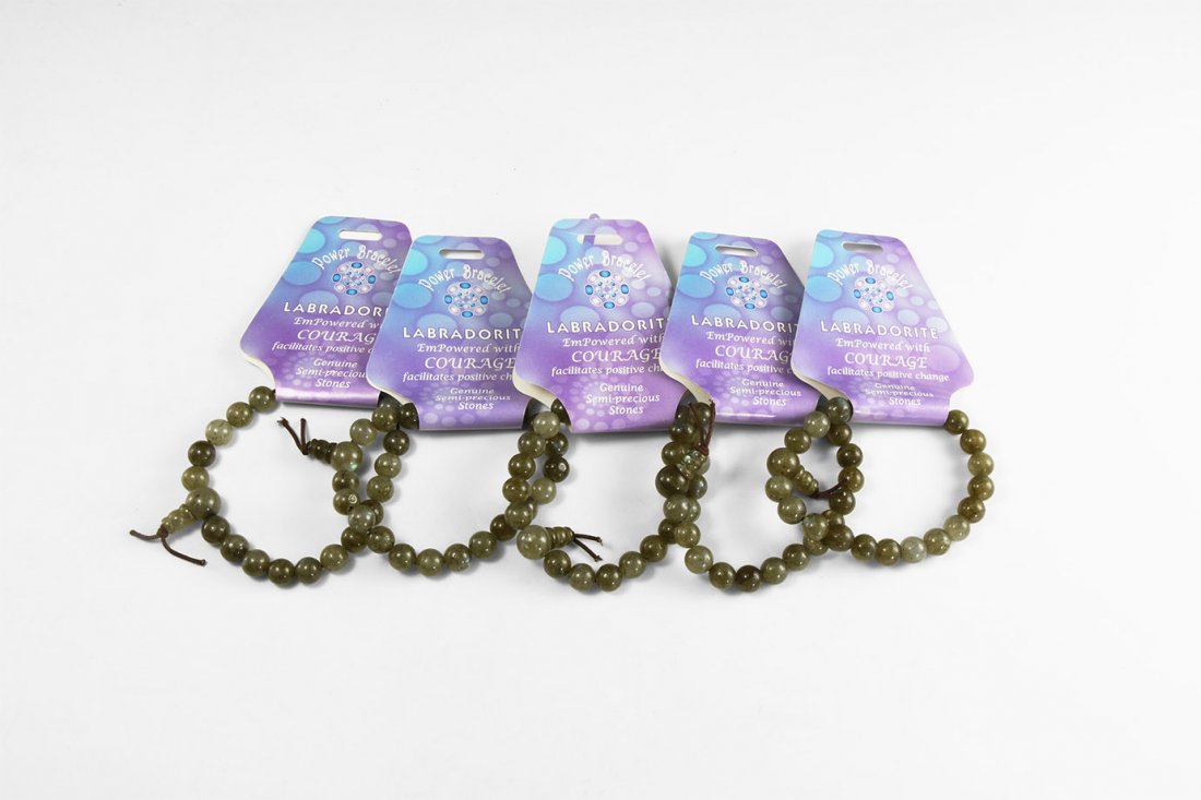 Natural History - Labradorite 'Power Bracelet' Group: A group of five labradorite 'power bracelets', with 32mm beads strung on elastic. See Bonewitz, Dr. Ronald Louis, Rocks & Minerals, 2008, p.241. 90 grams total, 16cm (6"). From the historic ‘Victori