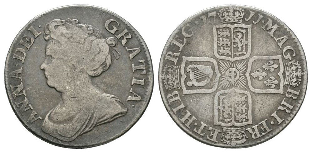 English Milled Coins - Anne - 1711 - Shilling: Dated 1711 AD. After Union, third bust. Obv: profile bust with ANNA DEI GRATIA legend. Rev: cruciform arms with MAG BRI FR ET HIB REG legend and date. S. 3610; ESC 6th, 1408 (old 1158"). 5.86 grams. .