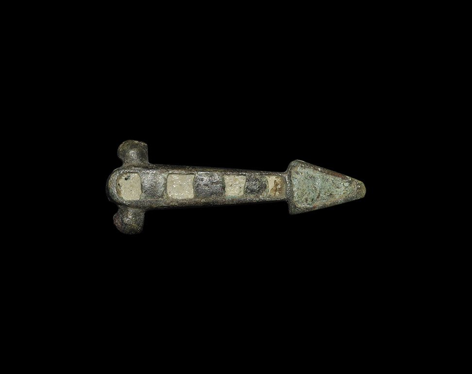 Roman Enamelled Phallic Appliqué: 1st-2nd century AD. A bronze phallic plaque with two attachment lugs to the reverse, enamelled cells to the upper face. 3.87 grams, 34mm (1 1/2"). Private collection, North London; acquired in the ear
