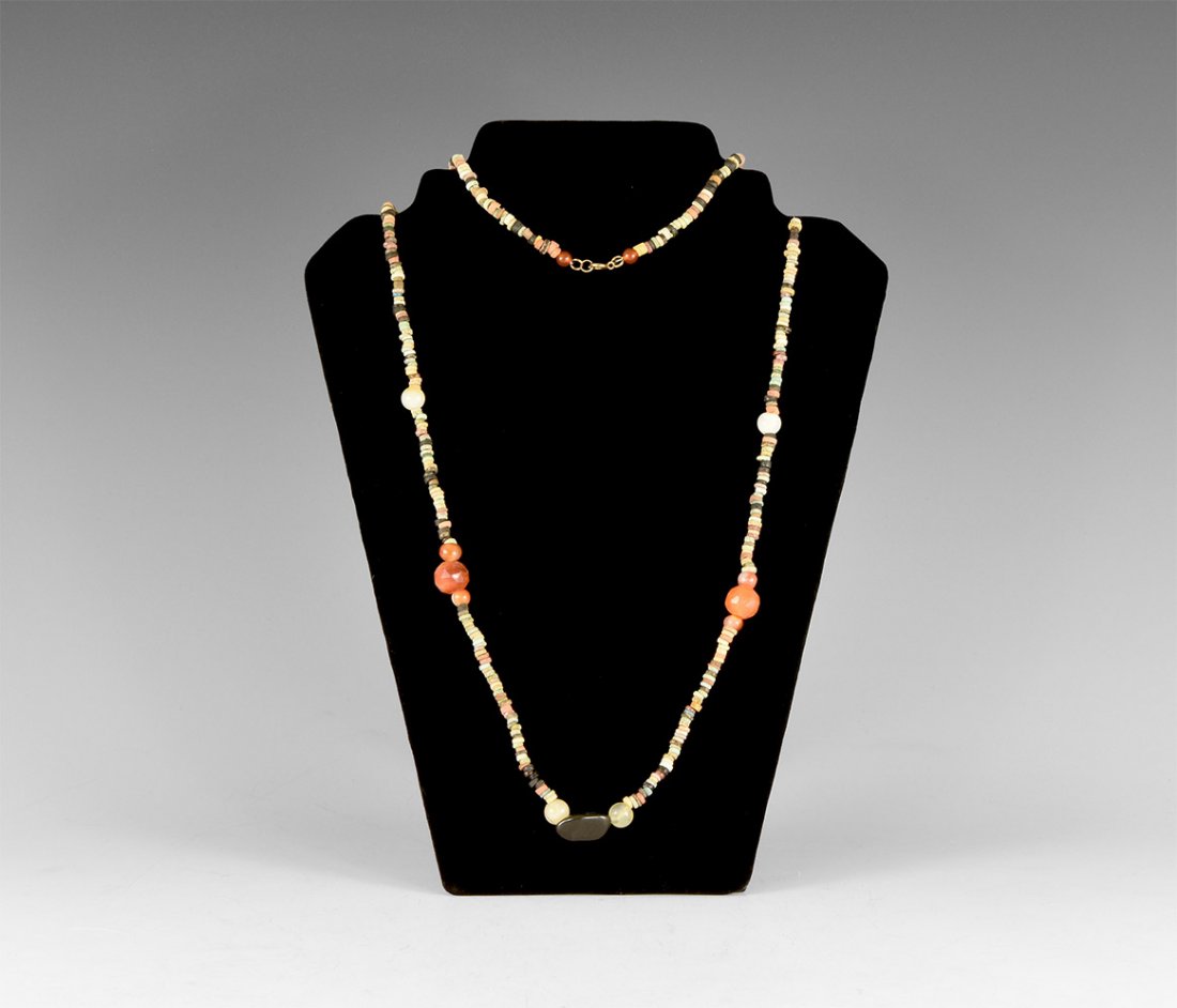 Egyptian Mummy Bead Necklace: Late Period, 664-332 BC. A restrung necklace of glazed composition beads with crystal, agate, carnelian and other spacers. 31 grams, 102cm (40"). Property of an East Anglia gentleman; acquired on the 