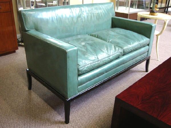 Pair of Mid-Century Settees: Pair of chic mid-century settees, each upholstered in leather and supported by chrome stands.