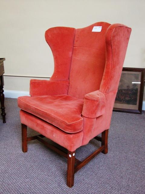 English Wing Back Chair: English Georgian style wingback chair upholstered in red velvet.