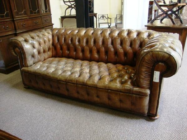 CHESTERFIELD TUFTED LEATHER SOFA: Good condition with light wear. 85 1/2"L, 38"D, 30 1/2"H.