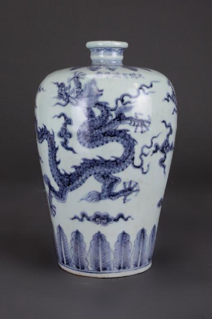 CHINESE BLUE AND WHITE MEIPING VASE: Painted of dragons flying amidst cloud nine. Six character horizontal mark to read Xuande on the shoulder.