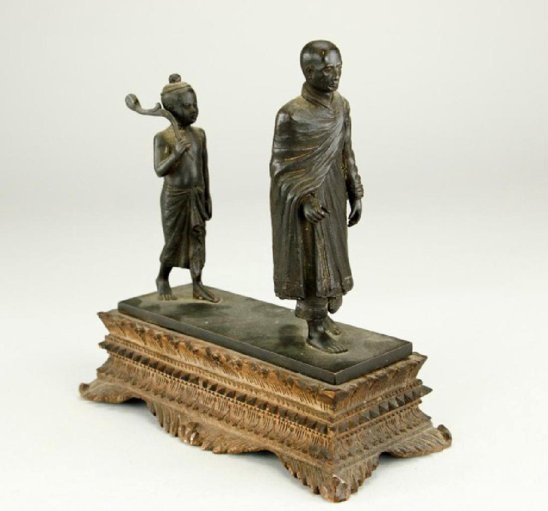 BRONZE FIGURAL GROUP OF A TIBETAN MONK AND BOY (1 of 8)