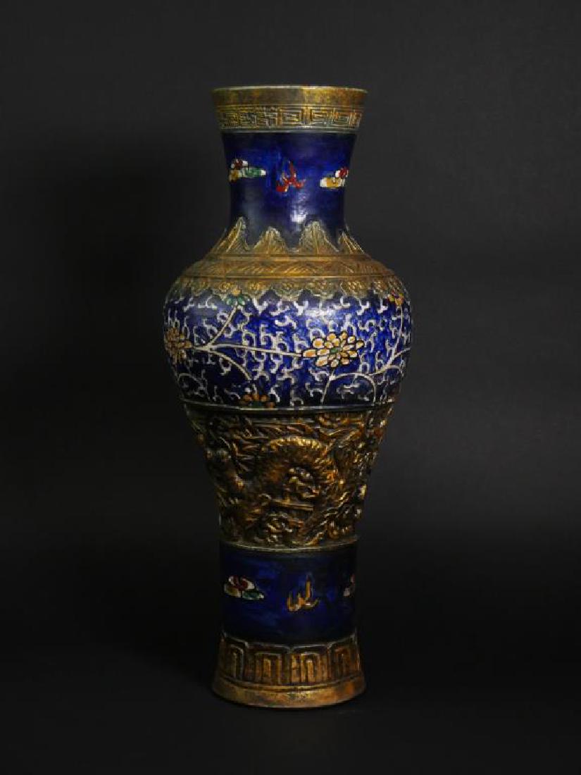 LARGE CHINESE BRONZE-MOUNTED PORCELAIN VASE: With floral motif on blue ground, ornately carved/chaised bronze plates decorated the foot, body, neck and mouth of the vase.