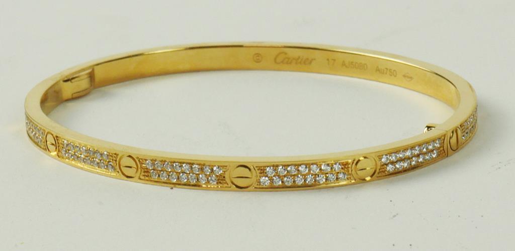 CARTIER-STYLE 18K YELLOW GOLD SLENDER BANGLE: With diamonds. wt: 1.65ct