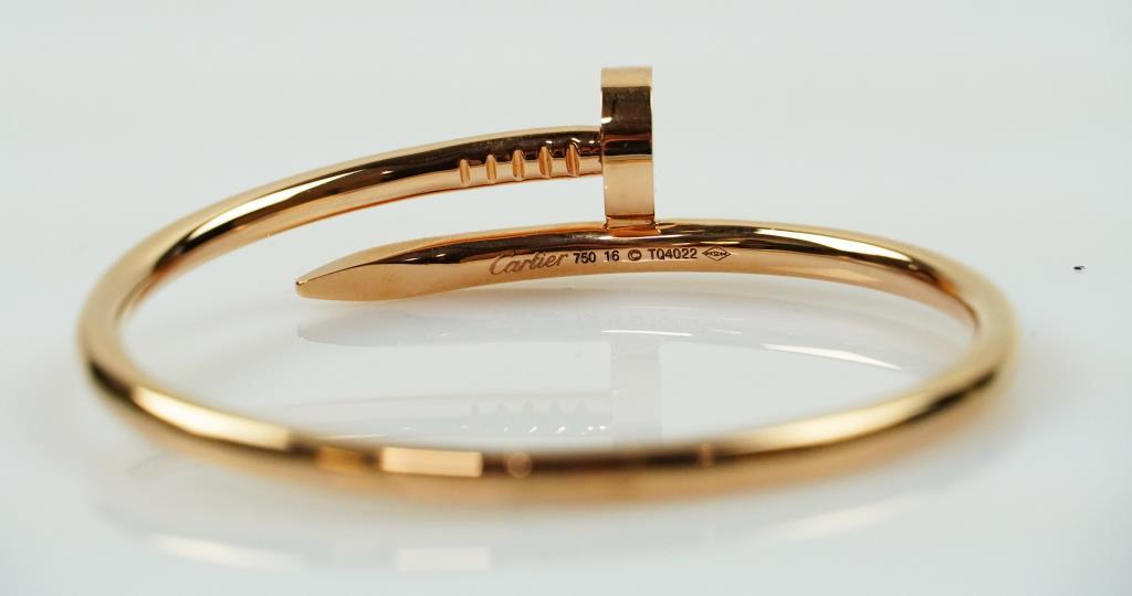 VINTAGE 18K ROSE GOLD CARTIER-STYLE BANGLE: Juste un Clou nail-style bangle. Size: 17