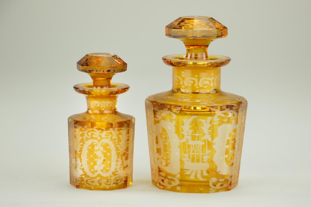 PAIR OF YELLOW BOHEMIAN GLASS PERFUME BOTTLES: Of a monochromatic golden tone and incised with scroll design. H: 4 3/4 in.