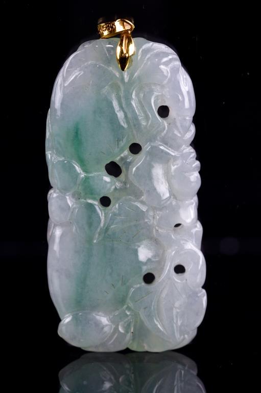 CHINESE TRANSLUCENT JADEITE AND 14K GOLD PENDANT: Carved green jadeite with 14K yellow gold surmount