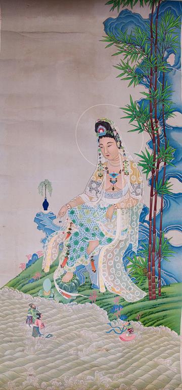 CHINESE SCROLL PAINTING OF A GUANYIN: Finely painted of a seated Guanyin dressing in an elaborated robe amongst rockery next to a river. H: 28 1/2 in., L: 13 3/8 in.