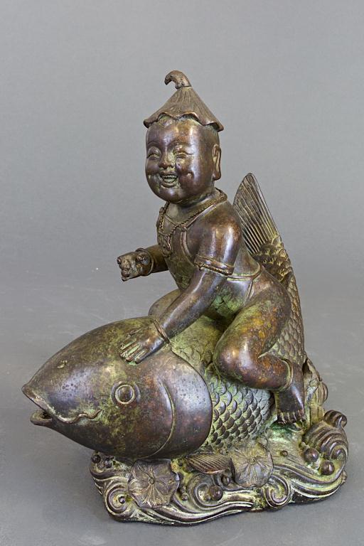 ANTIQUE CHINESE BRONZE FIGURE OF A BOY ATOP A FISH (1 of 1)