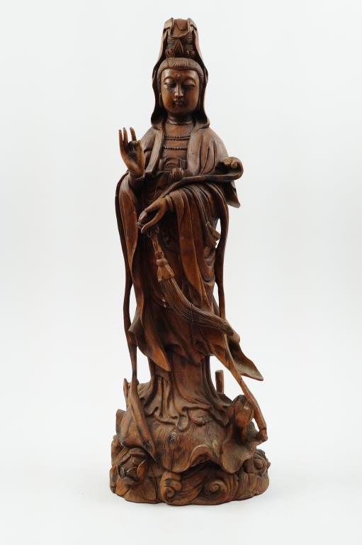 ANTIQUE WOODEN FIGURE OF A GUANYIN: In a flowing robe, and cradling her scrolling staff. H: 24 1/2 in
