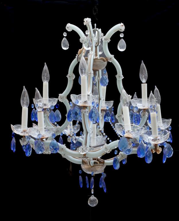 ART DECO STYLE BLUE GLASS 12-LIGHT CHANDELIER: The body of the chandelier a pale blue color; the loose hanging teardrop pendant a deeper shade of blue. H: 28 in., W: 24 in.