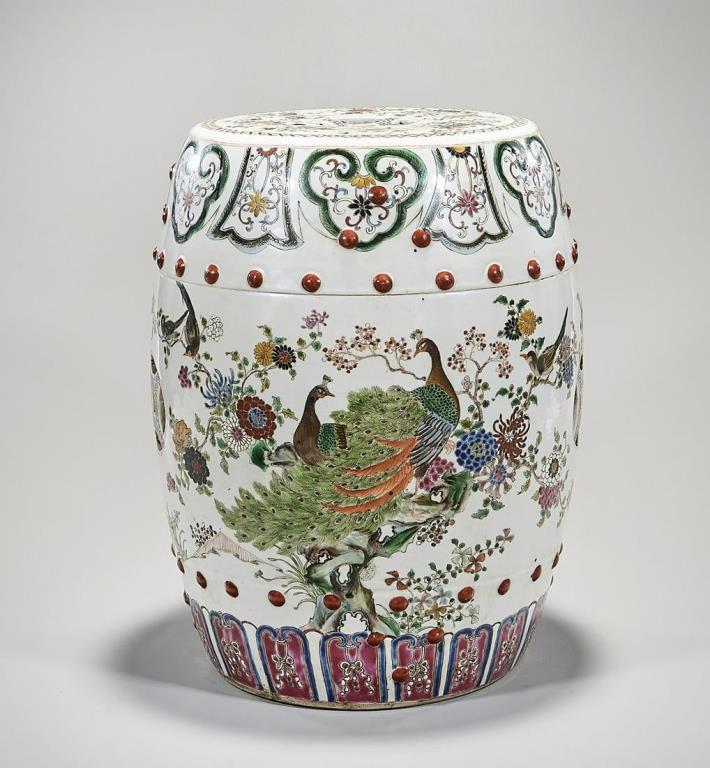 CHINESE ENAMELED PORCELAIN GARDEN SEAT: Beautifully painted with peacocks, birds and blossoming flowers on the body, with a reticulated double-coin design on the back. Circa 1940 - 1970. H: 17 in.