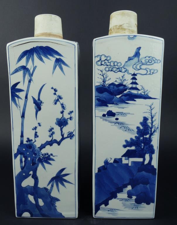 PAIR OF CHINESE BLUE AND WHITE SQUARE VASES: Beautifully painted with varying sceneries around the body. H: 15 3/8 in.