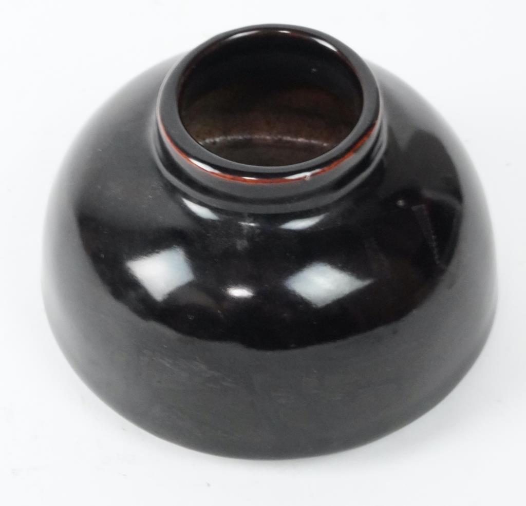 SMALL CHINESE BLACK GLAZE BRUSH WAHSER: Six-character mark to read Qianlong on the bottom. H: 2 1/2 in.